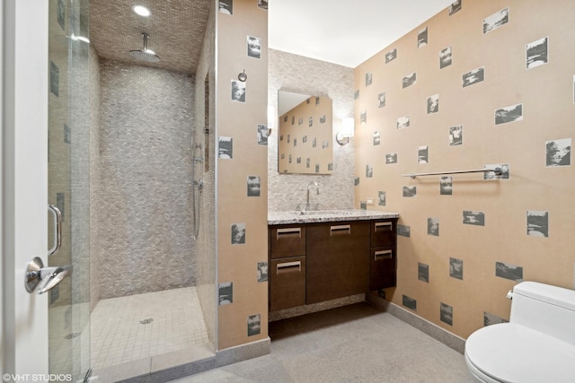 bathroom featuring toilet, vanity, walk in shower, and decorative backsplash