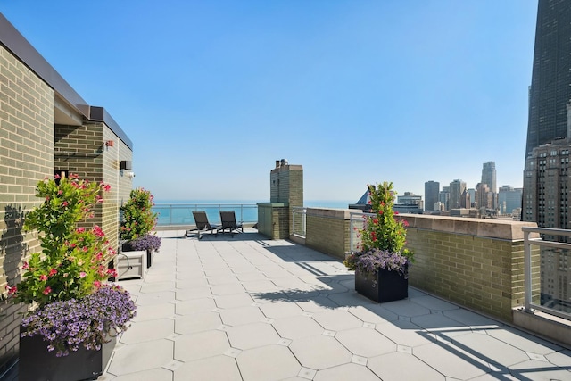 view of patio / terrace featuring a water view