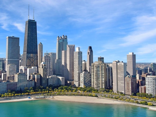 property's view of city with a beach view and a water view