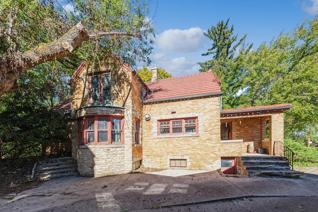 back of property with a patio area