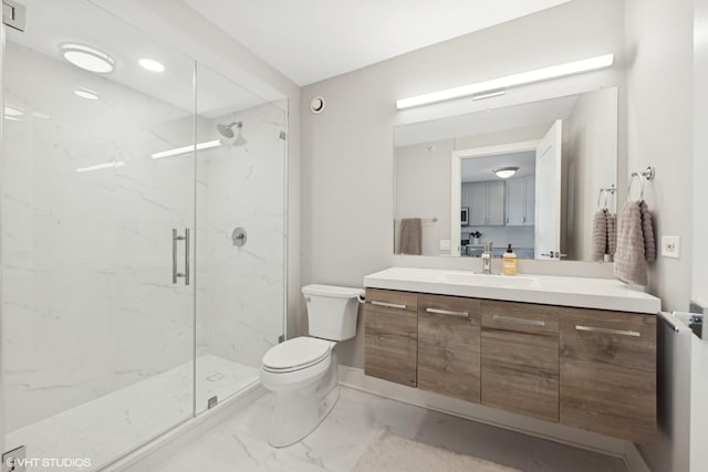 bathroom featuring vanity, toilet, and walk in shower