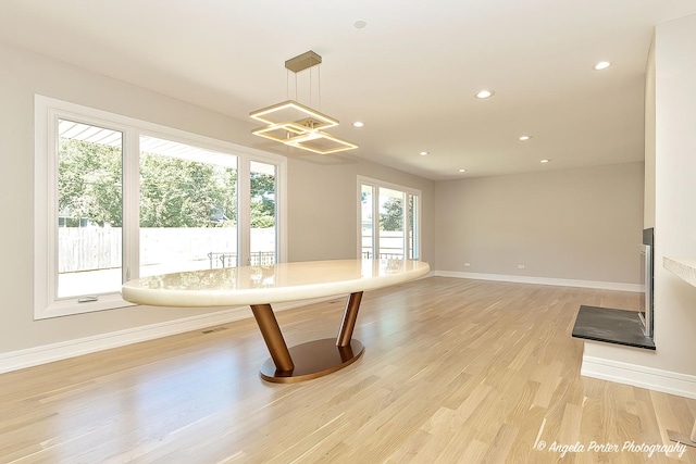 kitchen with pendant lighting and light hardwood / wood-style flooring