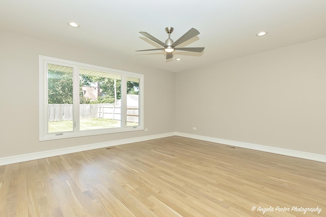 empty room featuring ceiling fan and light hardwood / wood-style floors