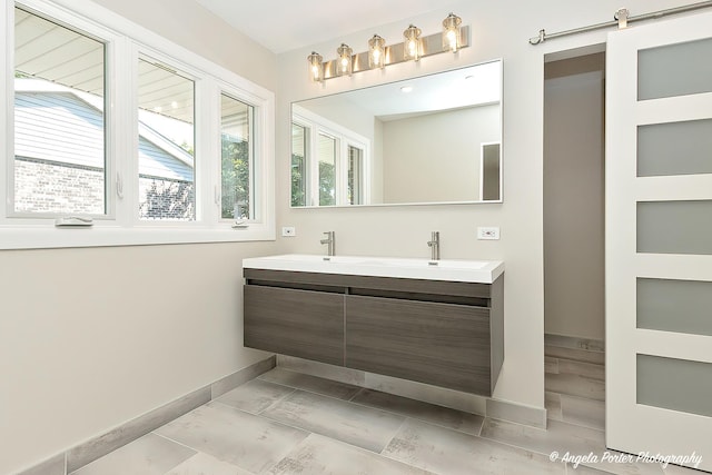 bathroom with tile patterned floors and vanity