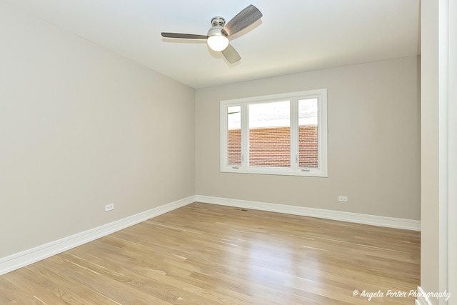 empty room featuring light wood-type flooring and ceiling fan