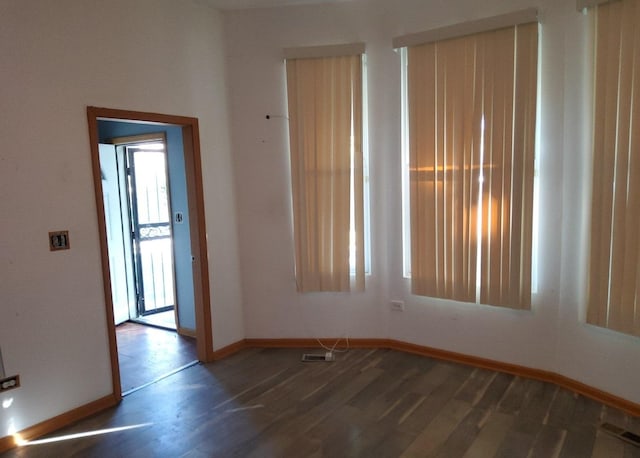 empty room featuring dark hardwood / wood-style floors