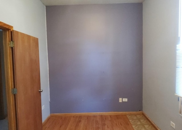 spare room with light wood-type flooring