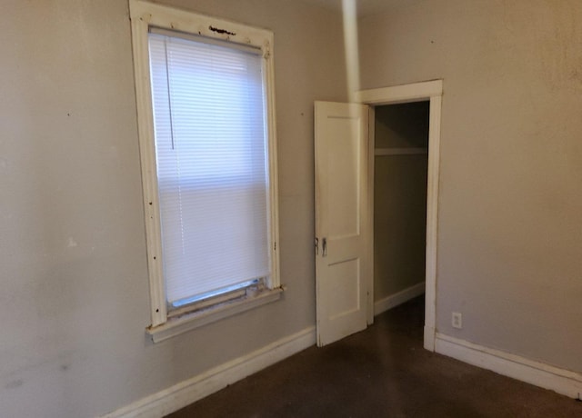 unfurnished bedroom with a closet