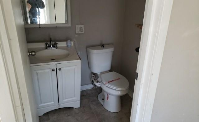 bathroom featuring vanity and toilet