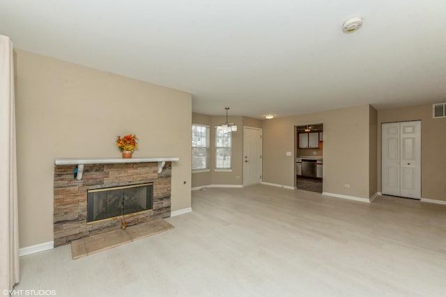 living room featuring light hardwood / wood-style floors and a fireplace