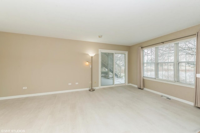 unfurnished room featuring light hardwood / wood-style floors