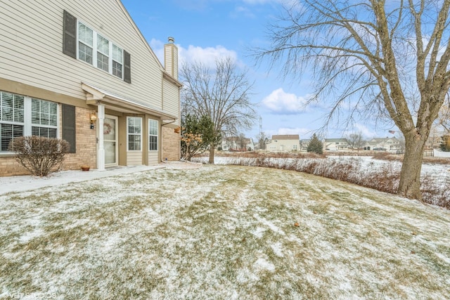 view of yard layered in snow