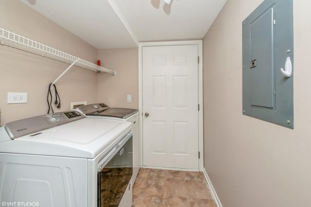 laundry room featuring washer and clothes dryer and electric panel