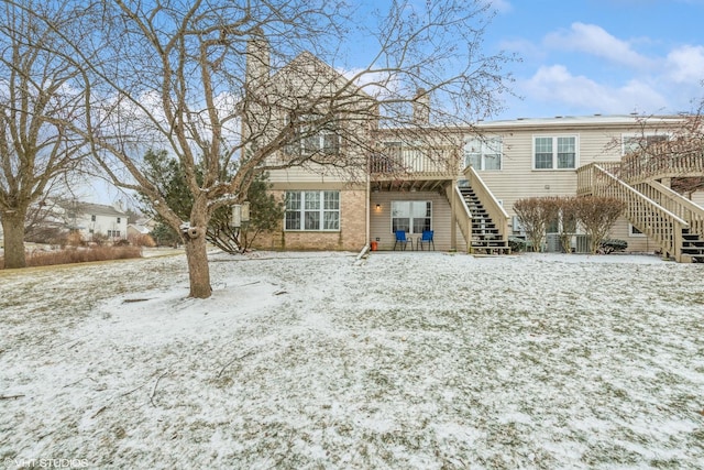 view of snow covered house