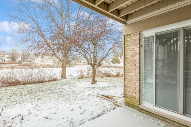 view of yard covered in snow