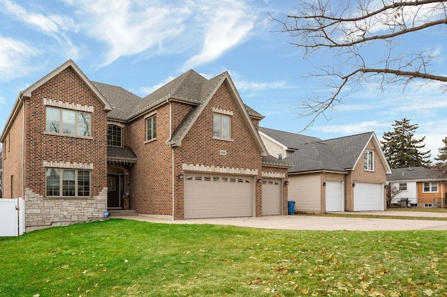 view of front of house with a garage and a front lawn