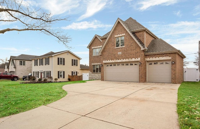 view of front of home featuring a front yard and a garage