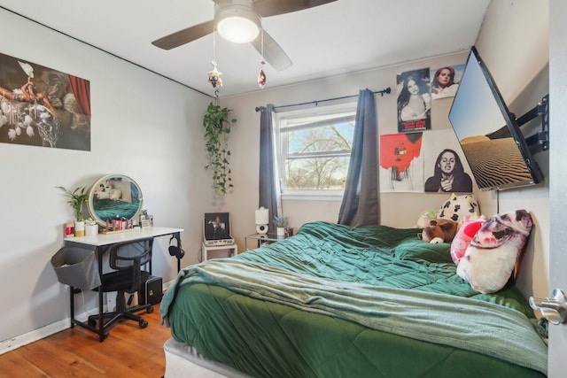 bedroom featuring ceiling fan and wood-type flooring