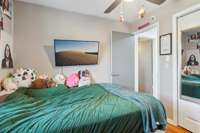 bedroom featuring ceiling fan and wood-type flooring