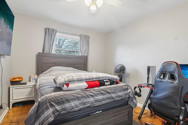 bedroom featuring wood-type flooring and ceiling fan