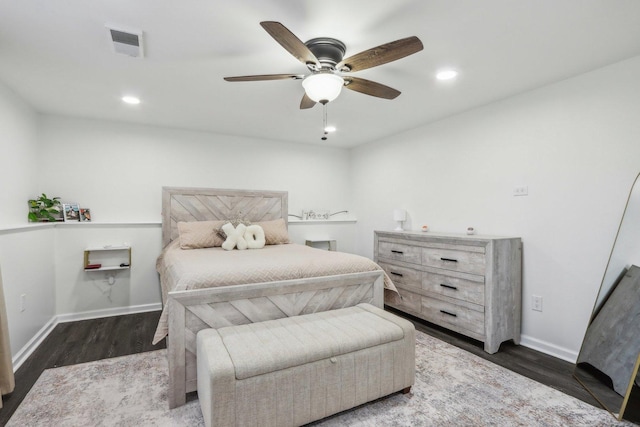 bedroom with ceiling fan and dark hardwood / wood-style flooring