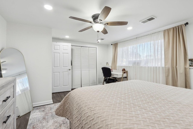 bedroom with a closet, ceiling fan, and wood-type flooring