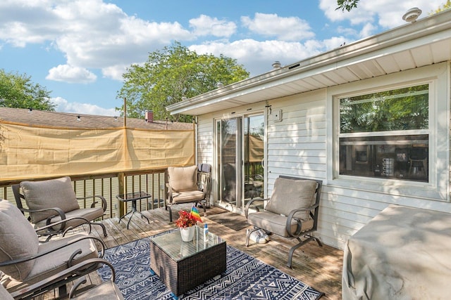 wooden deck featuring outdoor lounge area