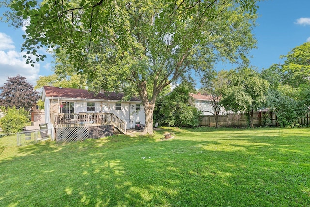 view of yard featuring a wooden deck