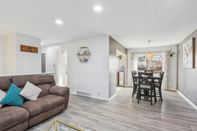 living room with light hardwood / wood-style floors