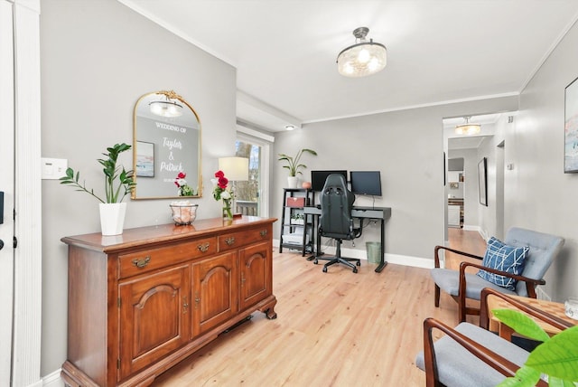 office area featuring light hardwood / wood-style flooring and crown molding