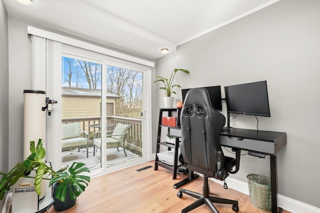 office space with hardwood / wood-style floors and ornamental molding