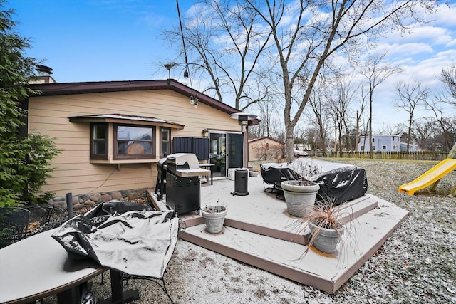 exterior space with a playground, a grill, and an outdoor living space