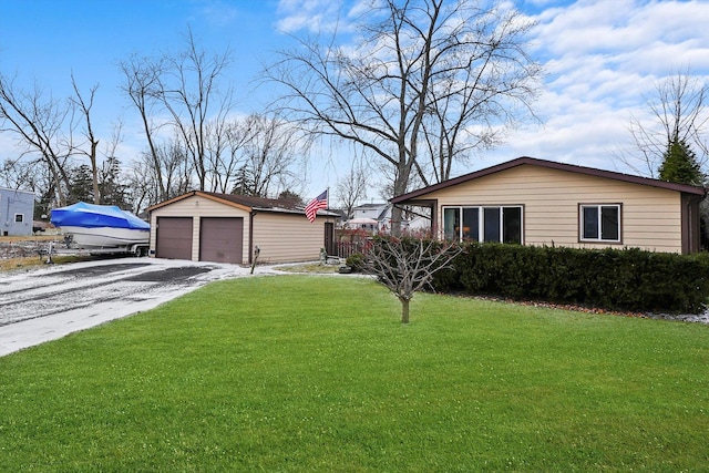 view of home's exterior with a lawn, an outdoor structure, and a garage