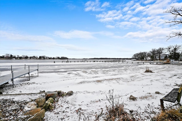 snowy yard with a rural view