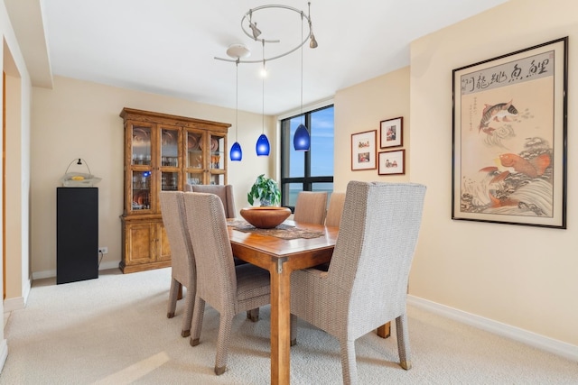 dining room featuring light colored carpet