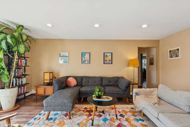 living room featuring light hardwood / wood-style floors and baseboard heating