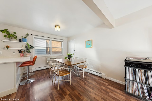 dining room with dark hardwood / wood-style floors, a wall unit AC, and a baseboard heating unit