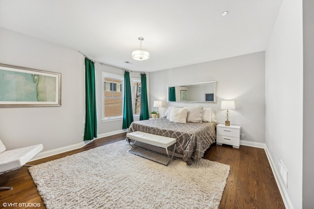 bedroom featuring dark wood-type flooring