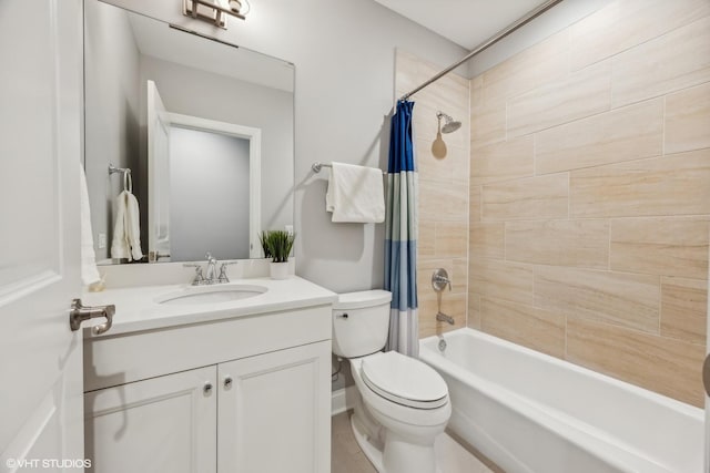 full bathroom with shower / tub combo with curtain, vanity, and toilet