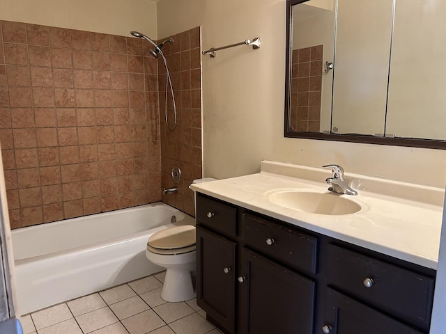 full bathroom featuring tile patterned flooring, vanity, tiled shower / bath combo, and toilet