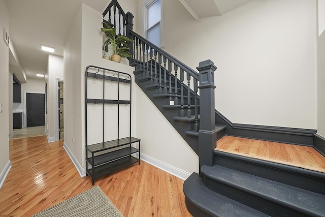 stairs featuring wood-type flooring