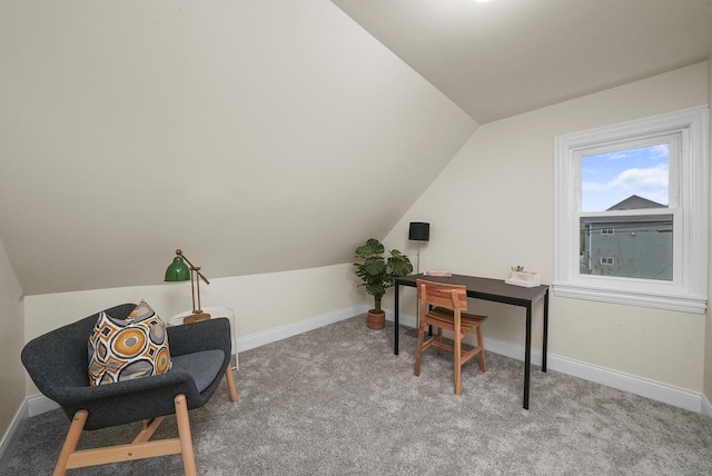 office area featuring light colored carpet and vaulted ceiling