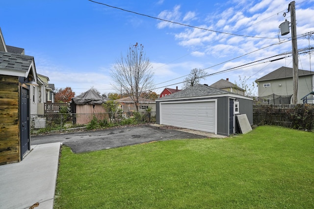 view of yard with an outbuilding and a garage