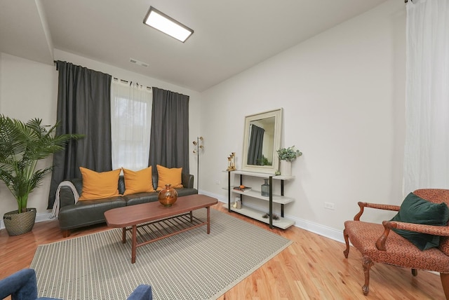 sitting room with light hardwood / wood-style flooring