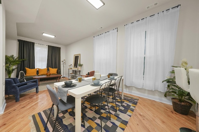 dining area with light hardwood / wood-style floors