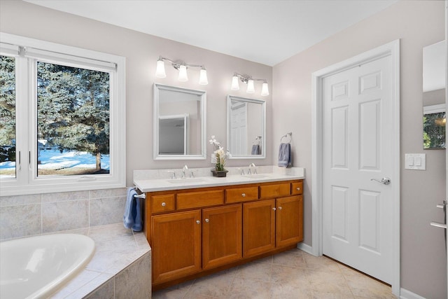 bathroom featuring vanity, tile patterned flooring, and a relaxing tiled tub