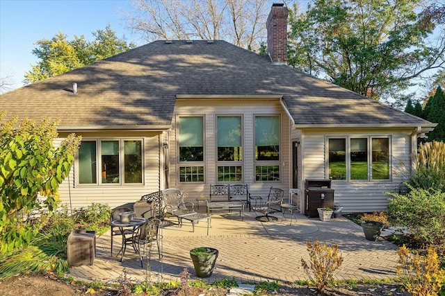 rear view of property featuring a patio area