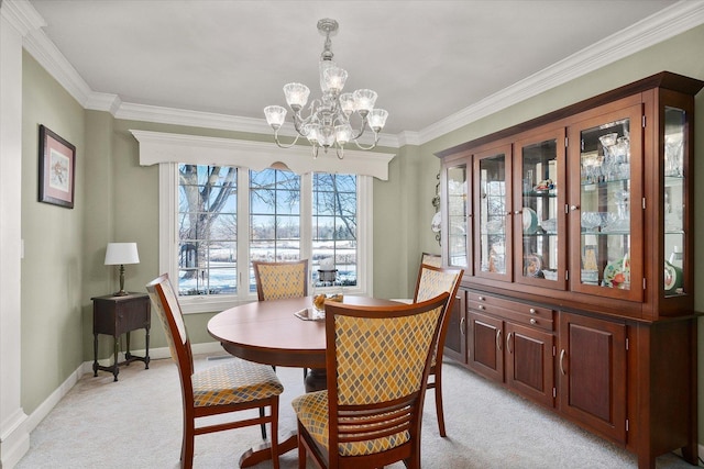 dining area with light colored carpet, a notable chandelier, and crown molding