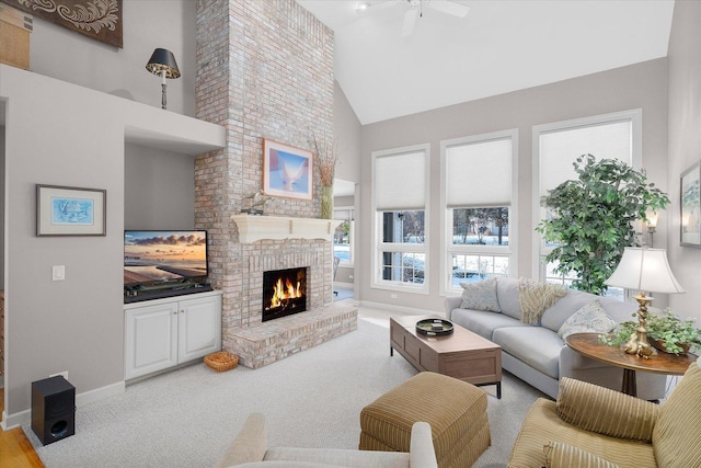 carpeted living room with a fireplace, high vaulted ceiling, and ceiling fan