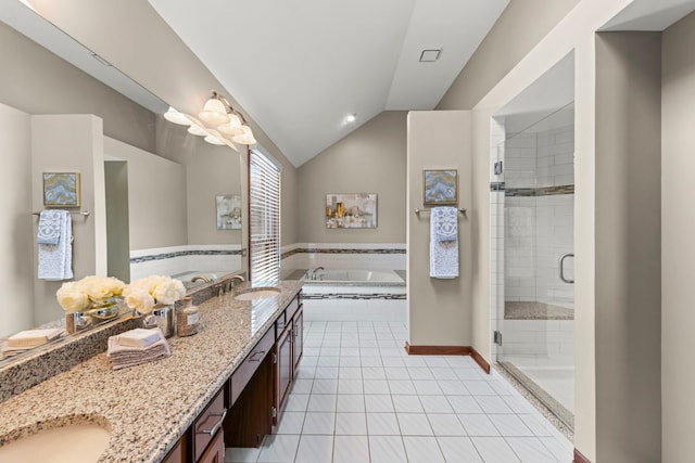 bathroom featuring tile patterned floors, vanity, separate shower and tub, and vaulted ceiling